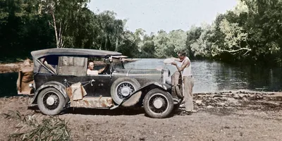 George Rollston and Arthur Willis fill their car’s radiator in the Northern Territory of Australia in 1933