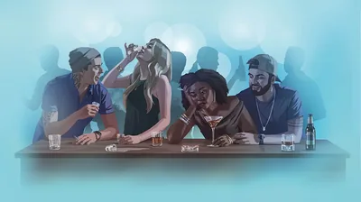 People drinking and partying at a nightclub.