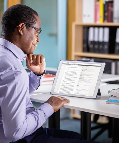 A man reads the Bible online