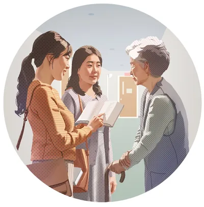 The woman preaching to an older woman. Her Bible teacher accompanies her in the ministry.