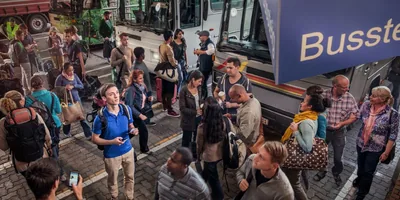 A young man at a bus station