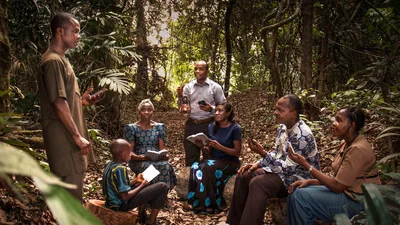During the great tribulation, a small group of Witnesses holds a congregation meeting in a forest