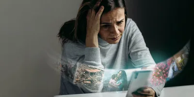 An anxious woman looking at her smartphone. She sees images of social unrest, natural disasters, a distressed mother holding her child, a coronavirus particle, and a hospital ward.