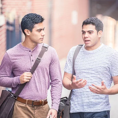 A Christian brother listens intently as another brother talks