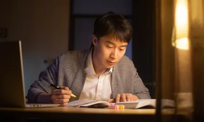 A young brother preparing for a Bible study using “Enjoy Life Forever!”