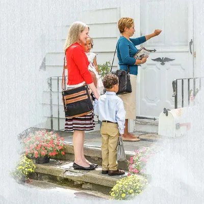 A sister helps another sister with her two little children in the field ministry