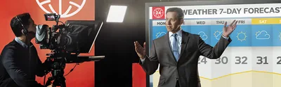 A weatherman giving a seven-day forecast.