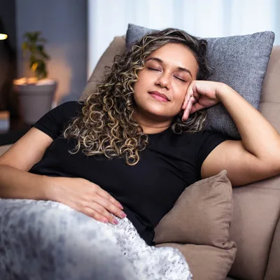 A young woman napping.