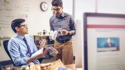 A brother witnessing to a workmate during their lunch break.