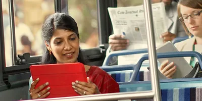 Jehovah’s Witnesses study on their electronic devices while riding public transportation