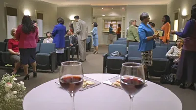 A scene from the video: “Jesus ‘Came to Seek and to Save What Was Lost.’” Brothers and sisters at a Kingdom Hall on the night of the Memorial, warmly conversing with one another.