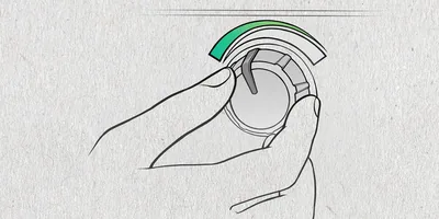 A person turns down a thermostat