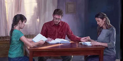 A family reads the Bible together