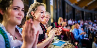 Sisters applaud at a regional convention