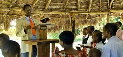 A circuit overseer giving a talk to a congregation.