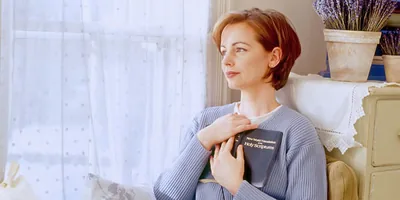 A woman contemplating what she just read in the Bible.