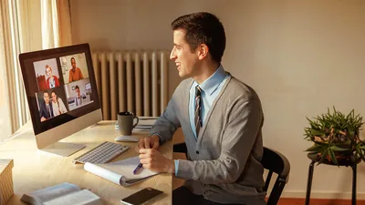 The brother shown earlier, happily witnessing by letter. He has joined other brothers and sisters via videoconferencing.