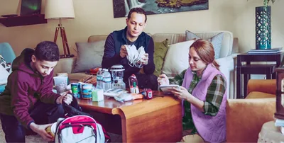 A family prepares emergency supplies