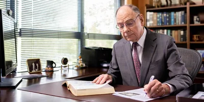 Brother David Splane working at his desk.