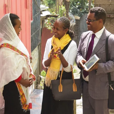 A husband and wife work together in the field ministry