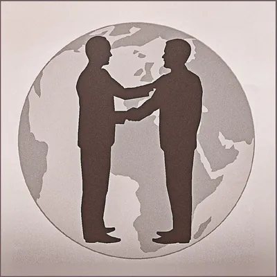 Two men shake hands