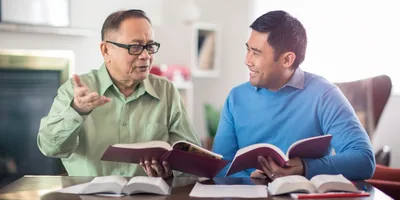 An older brother encourages a younger brother