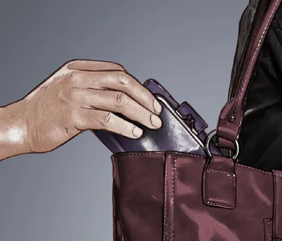 A person steals a wallet out of a bag