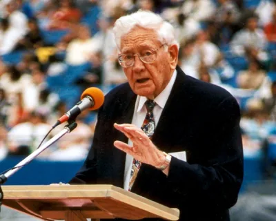 Albert Schroeder speaking at a 1998 international convention
