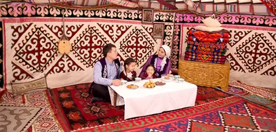 A family inside a yurt
