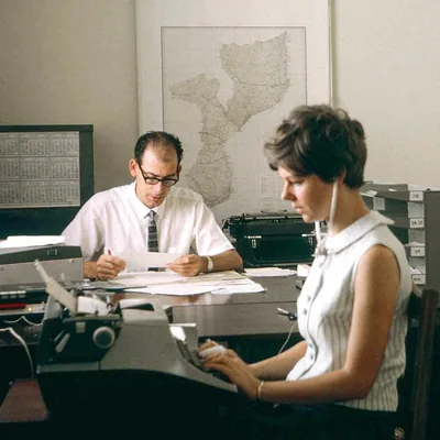 Keith and Anne working together in an office.