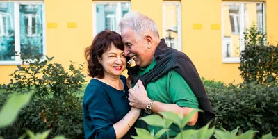 A happy older couple embracing.