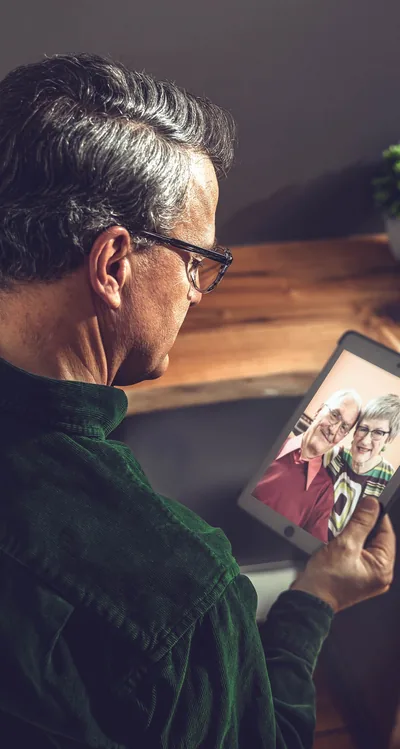 One of the scientists referred to earlier holds a picture of the older couple in the opening article