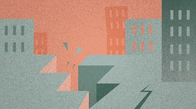 An earthquake causing buildings to crack.