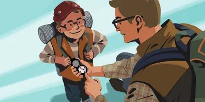 Father and son use a compass for direction