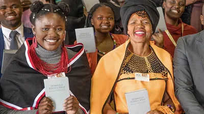 Sisters and a brother holding the newly released ‘New World Translation’ in Xhosa.