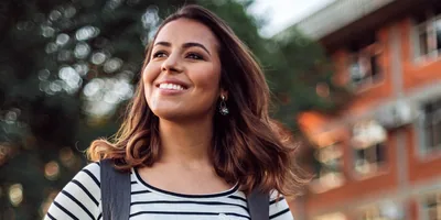 A young woman smiling.