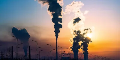 Industrial smokestacks polluting the environment.