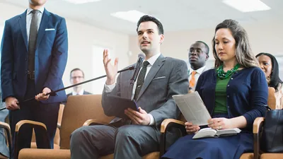 A brother giving a comment at a congregation meeting.