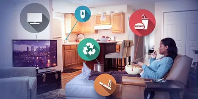 A woman watches television and eats junk food