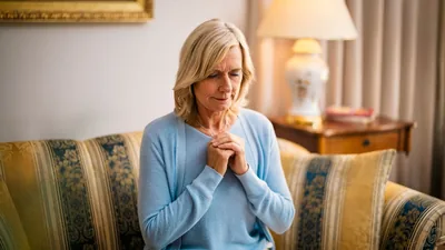 One of the newly baptized sisters shown in the previous image, praying in her home.