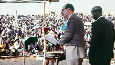 Delivering a talk in Chichewa at a Chichewa/​Shona convention in Zimbabwe