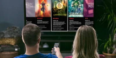 A couple look at advertisements for spiritistic movies on television