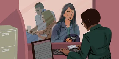 A young woman makes a payment at a bank