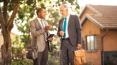 An older brother listens as a younger brother offers him counsel