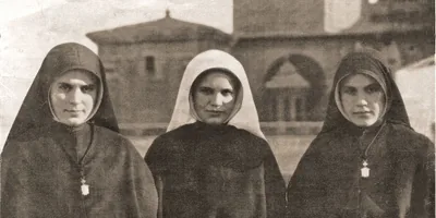 Three of the Fernández sisters, two wearing Catholic nun habits and one wearing the white veil of a novitiate