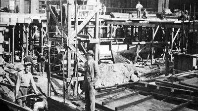 A construction site where brothers are working on the early stages of a new building.