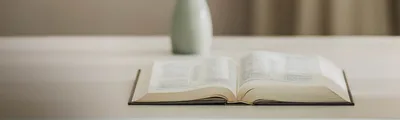 An open Bible on a table.