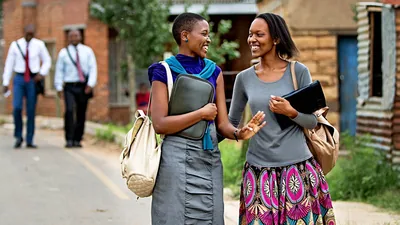 Two sisters joyfully working together in the ministry.