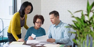 A couple discuss medical treatment with a terminally ill loved one