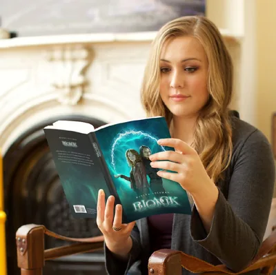 A woman reads a book about the supernatural